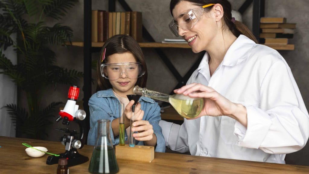 girl teacher doing science experiments