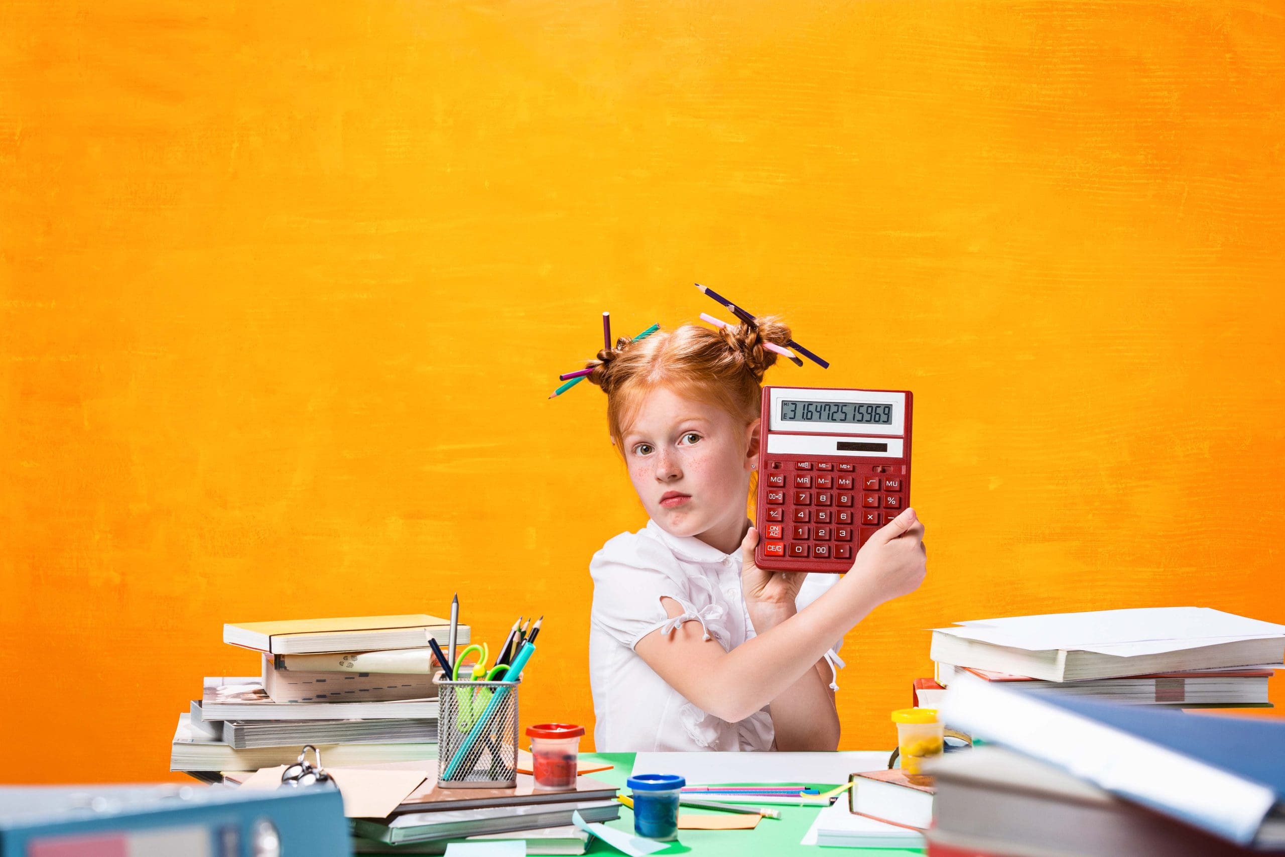 The Redhead teen girl with lot of books at home