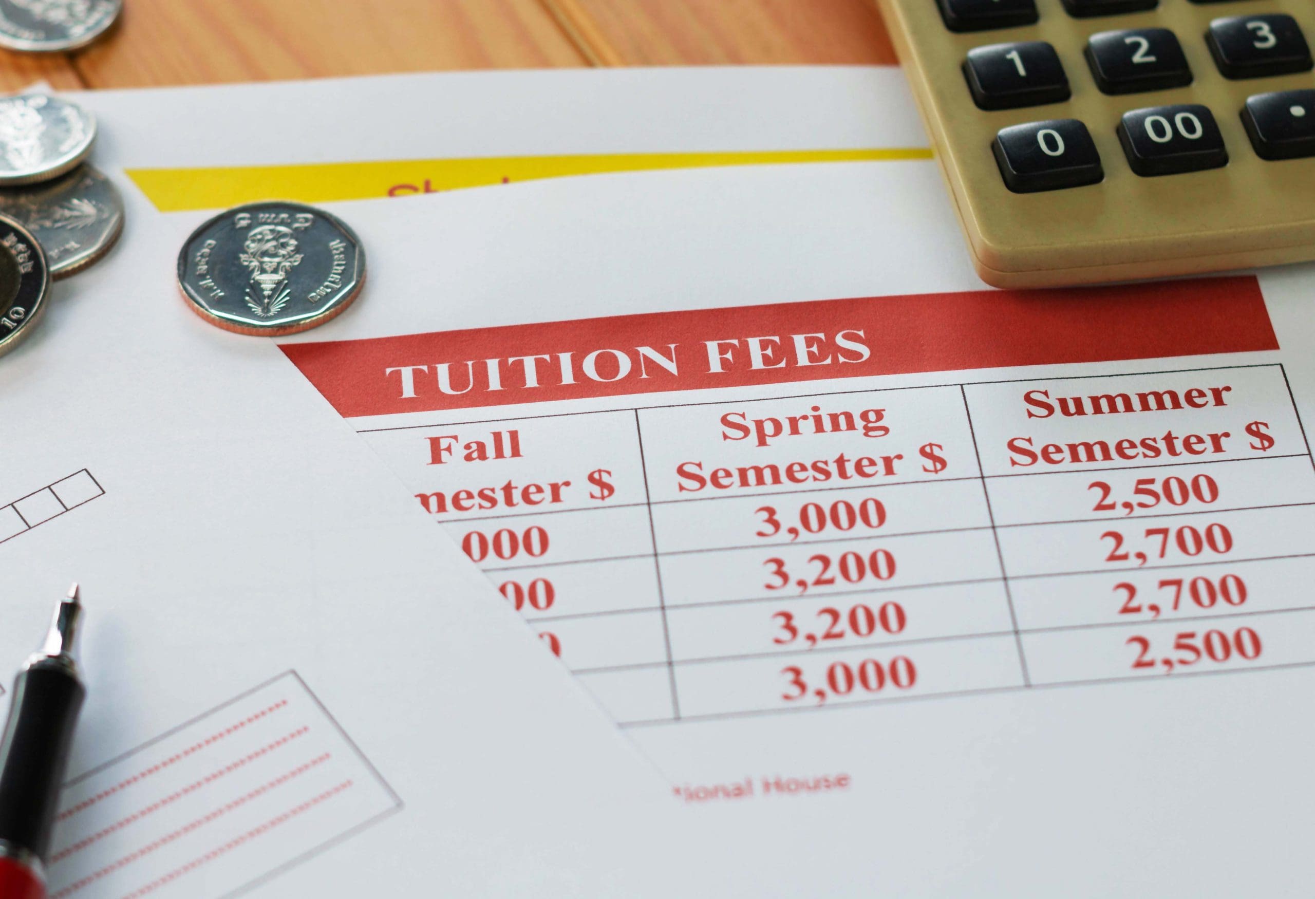 close up school tuition fees on wooden table